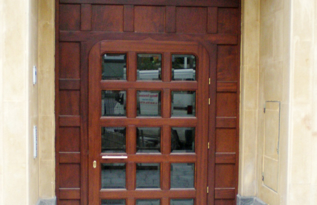 Custom fabrication and installation of wooden outdoor doors.